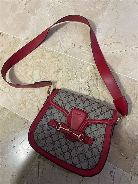 como reconocer una cartera gucci original|ver bolsa gucci real.